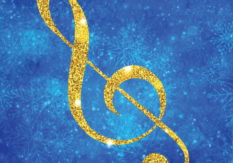 A glittering treble clef on a background of falling snowflakes