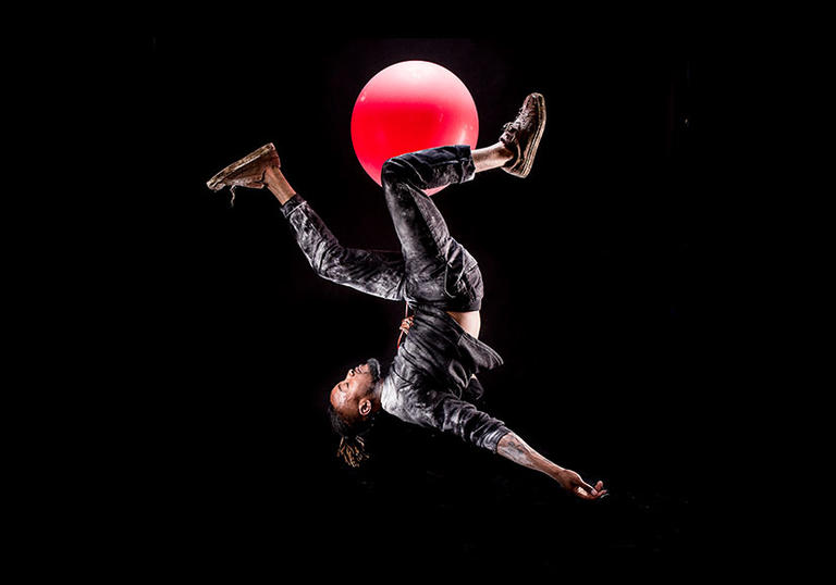 Man falling with balloon