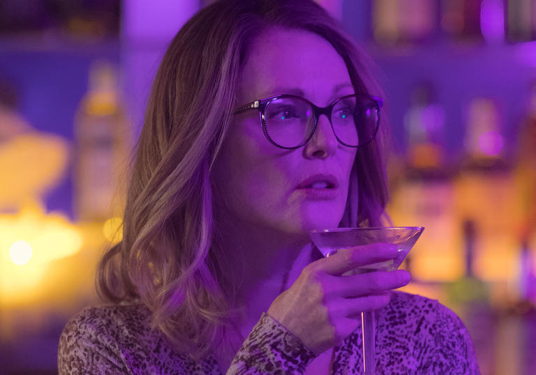 Julianne Moore drinking a cocktail