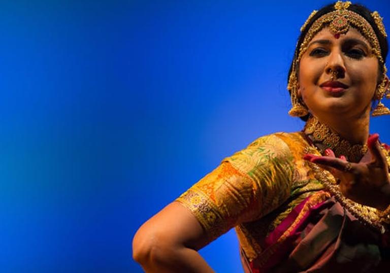 Dancer Swarnamalya Ganesh against a blue background