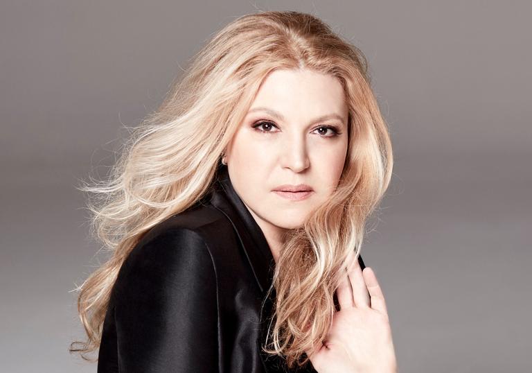 Eliane Elias facing the camera with her hand in her hair