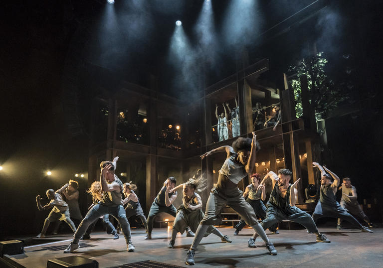 A group of dancers in an energetic pose