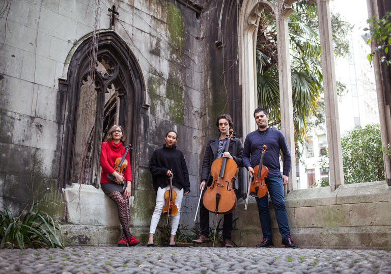 Portorius String Quartet pictured outside holding instruments