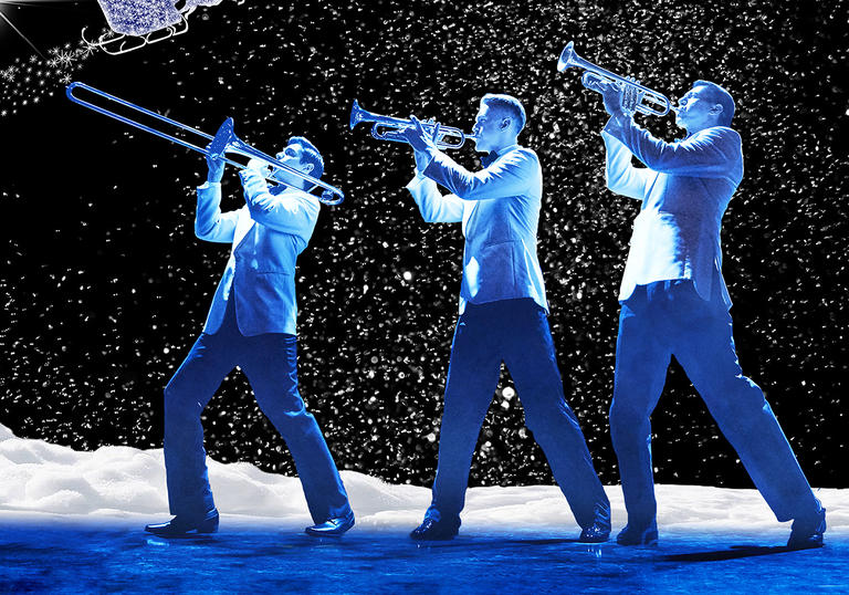 Image of three men playing trumpet, the two vocalists and the conductor