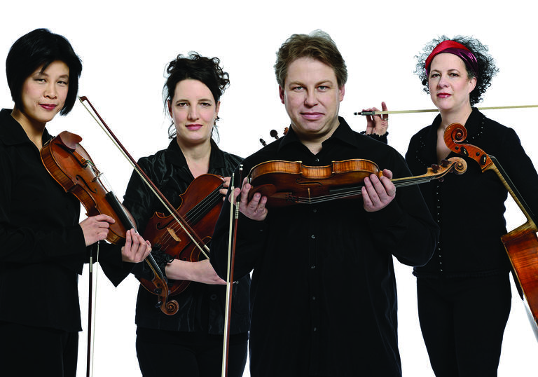 Quatuor Bozzini pictured holding instruments