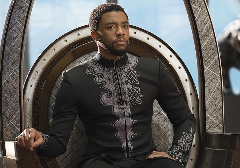 Chadwick Boseman sitting on the throne in Wakanda