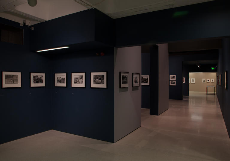 Gallery with blue walls and phtographs
