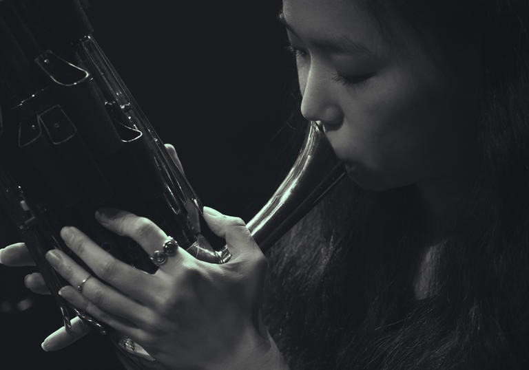 Park Jiha playing a traditional wind instrument