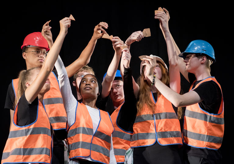 Students in orange high vis jackets