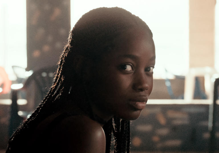 A young woman, Ada, looks directly into the camera in Mati Diop's Atlantics