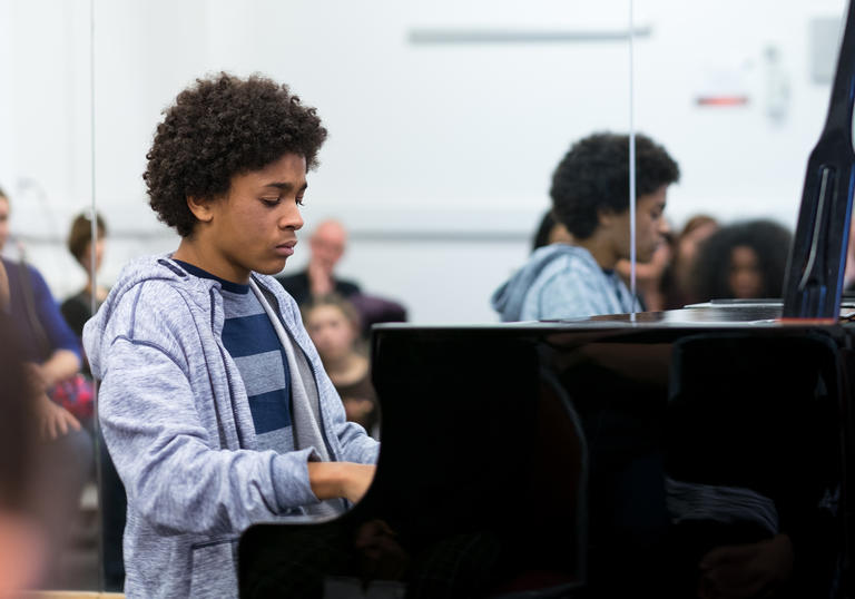 Image of boy playing piano