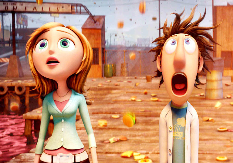 Flint standing looking up at the sky as food falls down
