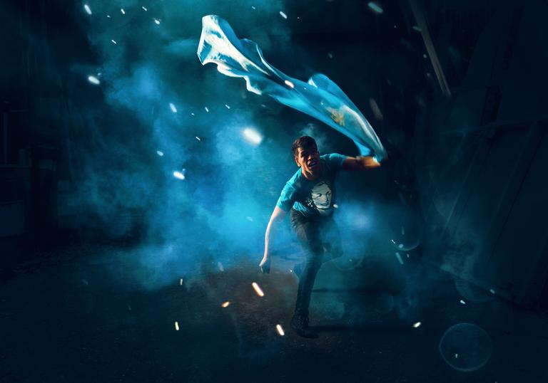 blue environment, man running with Argentinian flag