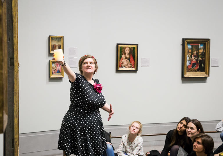 Women standing talking to a group of children