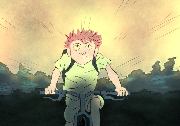 a teenage boy rides a bike