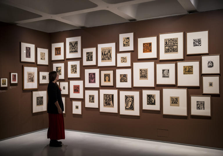 Women in brown gallery space