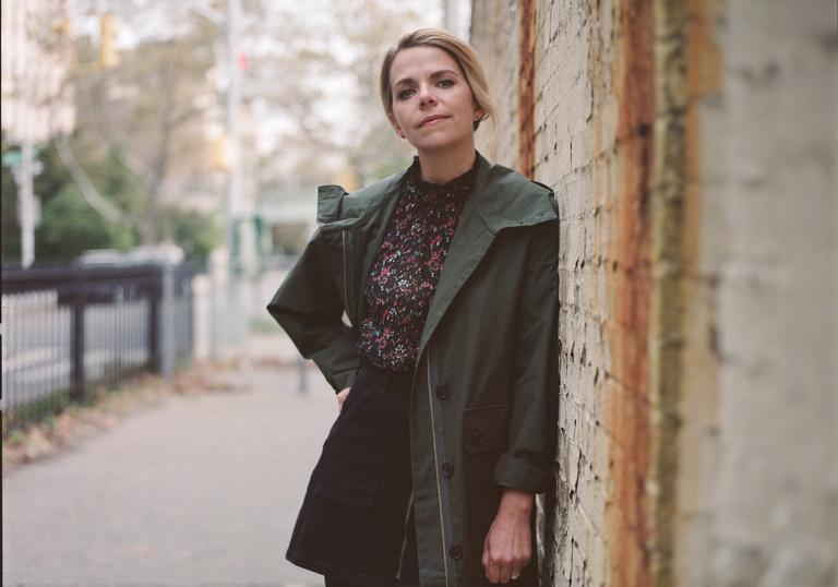 Aoife O'Donovan leaning against a wall
