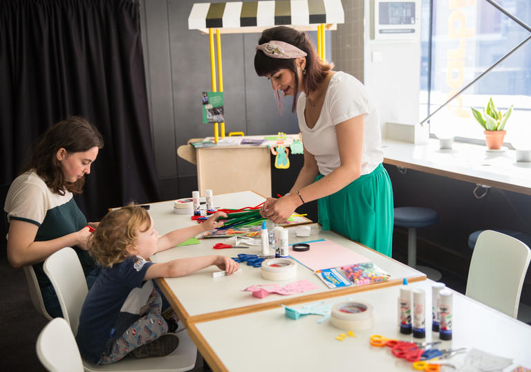 A young child does a workshop at the Family Film Kiosk