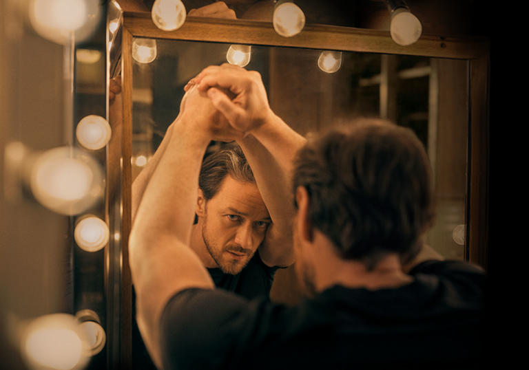 James McAvoy reflected in a mirror