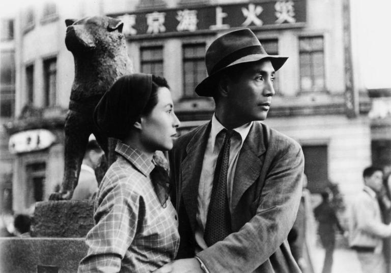 A black and white image of a man and a woman in Japan in the 1940s
