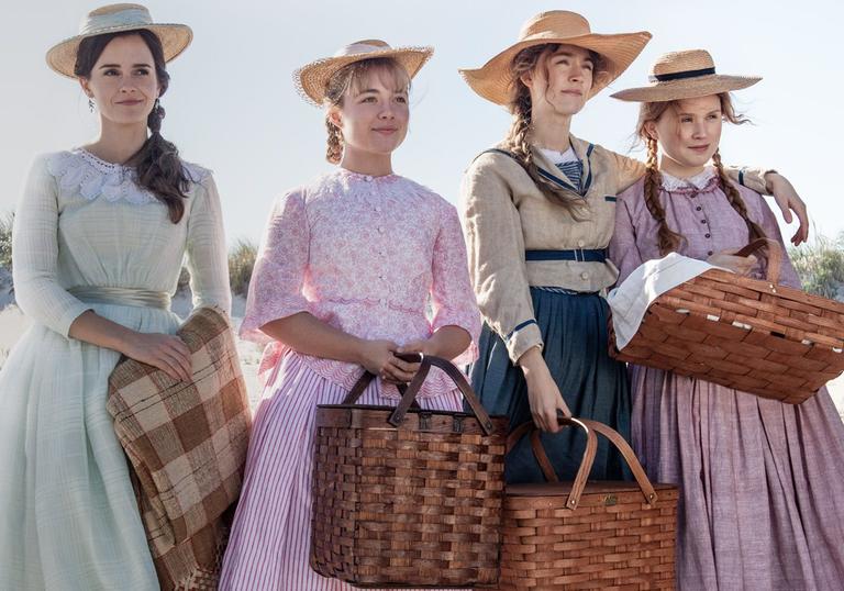 the four sisters standing on the beach with picnic baskets