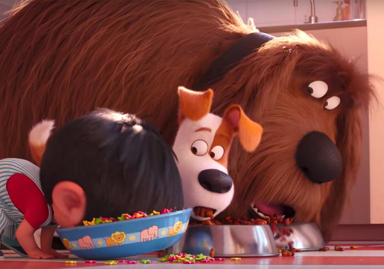 the two dogs watch as the baby eats out of the dog bowl