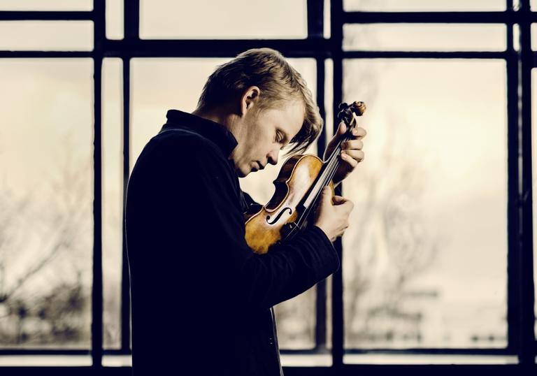 Pekka lost in the moment as he passionately plays his violin