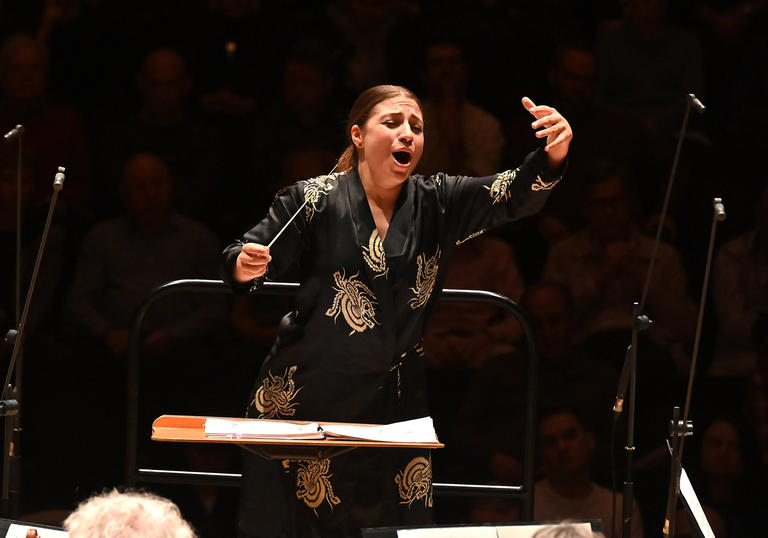 Dalia conducting with great enthusiasm