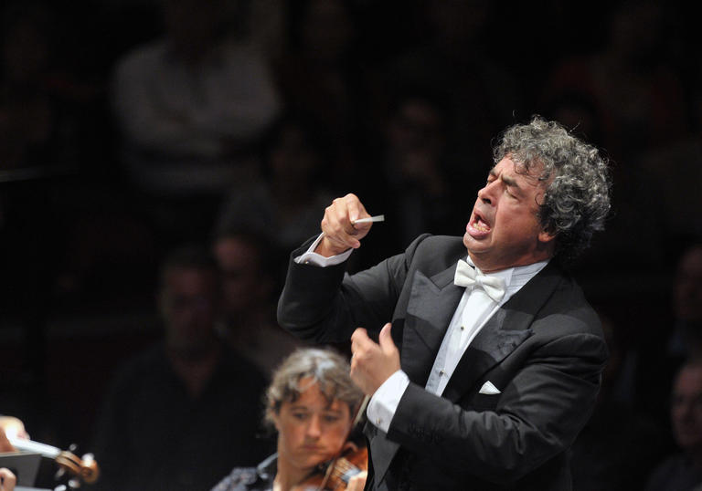 Seymon conducting with great passion and vigor