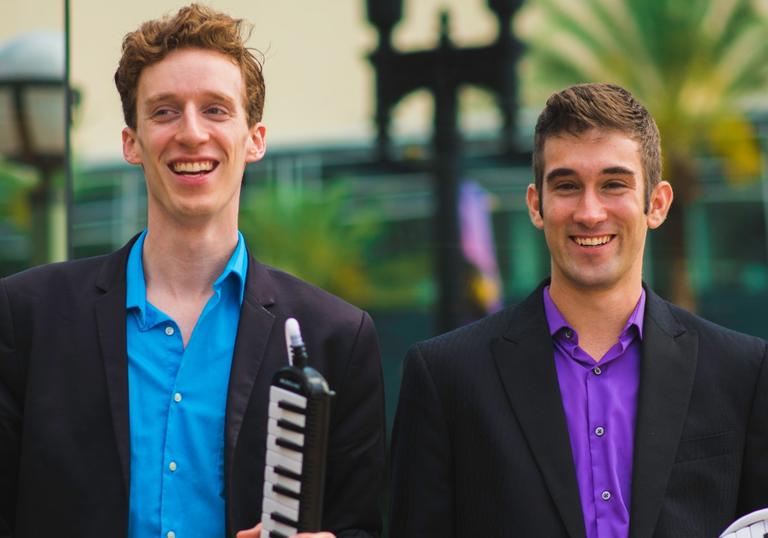 The Melodica Men smiling excitedly 