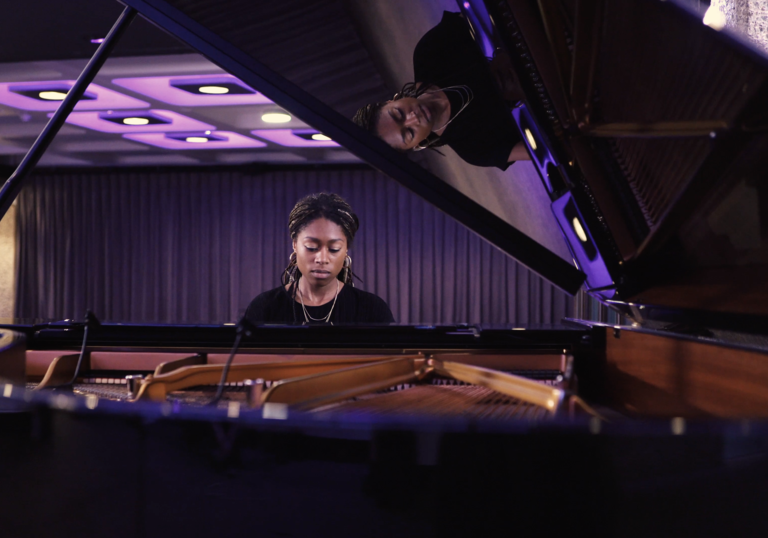 photo of isata kanneh-mason playing the piano