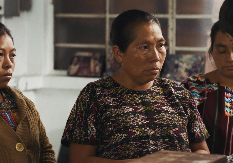 A man speaking to three women