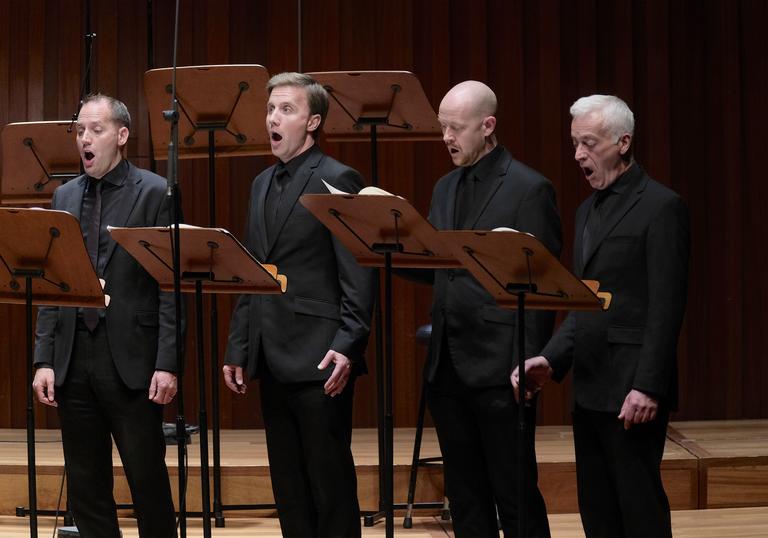 Four of the men of BBC Singers singing