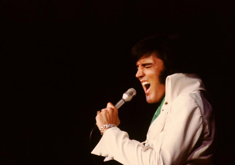 Elvis singing into a microphone