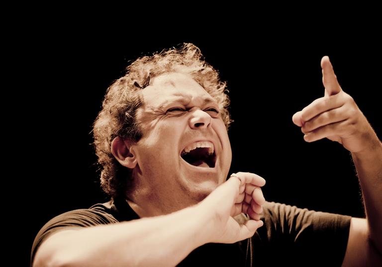 An impassioned Richard Edgarr conducting with an open mouth
