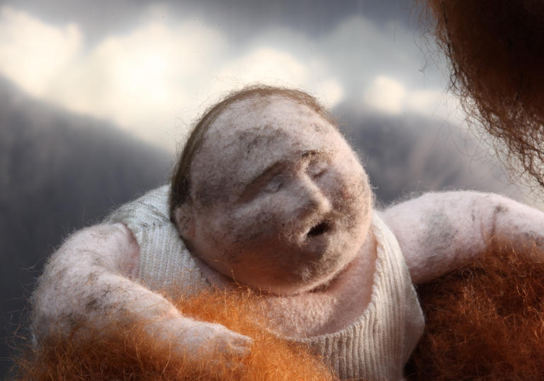 An animated man in somebody's arms