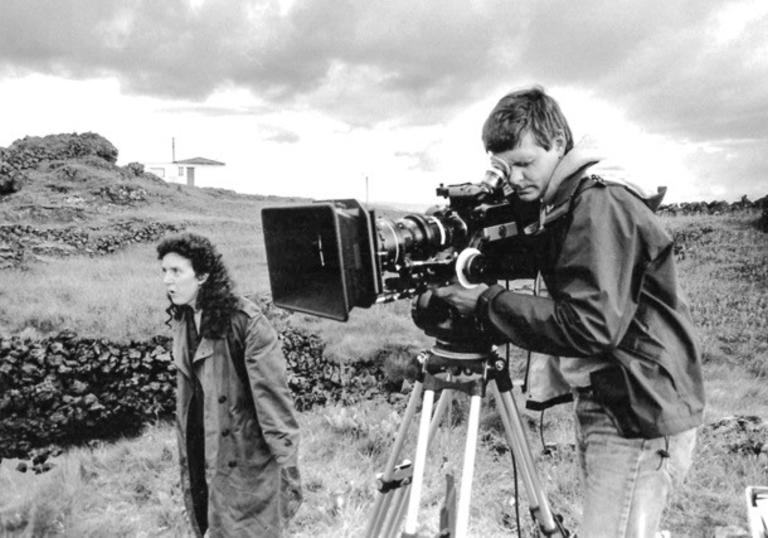 black and white photo of nietzchka directing while randolph Sellars photographs a scene