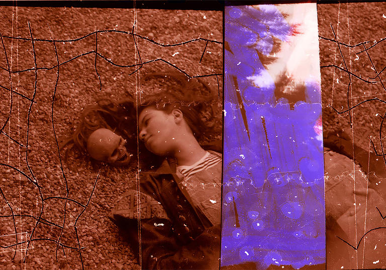 A girl likes on a floor next to a skull, with a purple strip in A Different Category