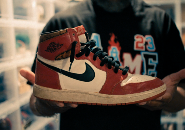 A collector holds an Air Jordan sneaker