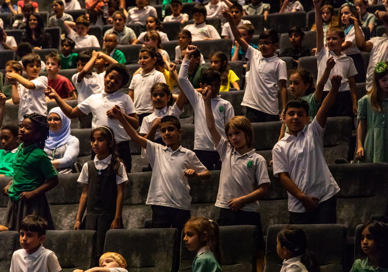 Group of students from Greenleaf School enjoying a performance