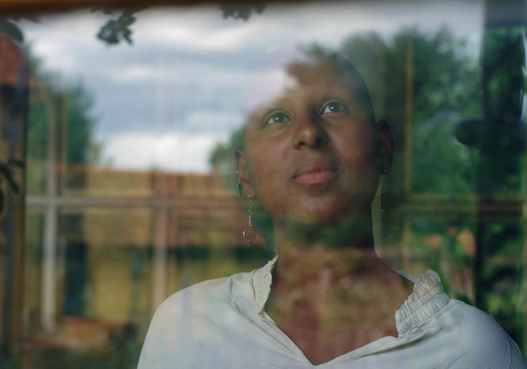 Woman looking out of window