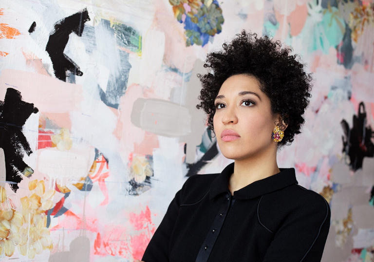 Image of Julia Bullock against a multi-coloured wall