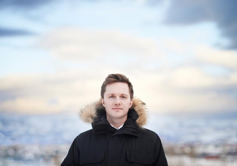 James McVinnie in front of a blurred out background