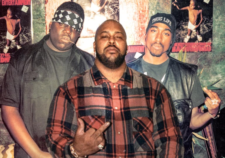Biggie Smalls, Suge Knight and Tupac Shakur pose together in a photograph