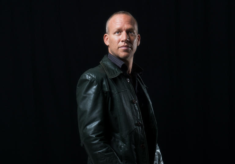 photo of Avishai Cohen against a dark background