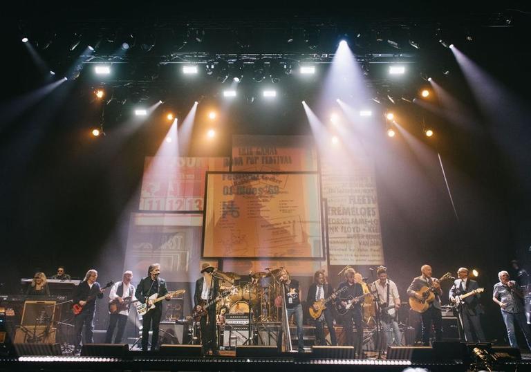 a collection of famous rock stars on stage