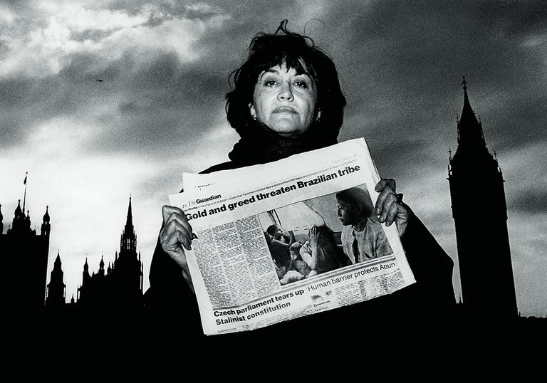 A woman holding a newspaper