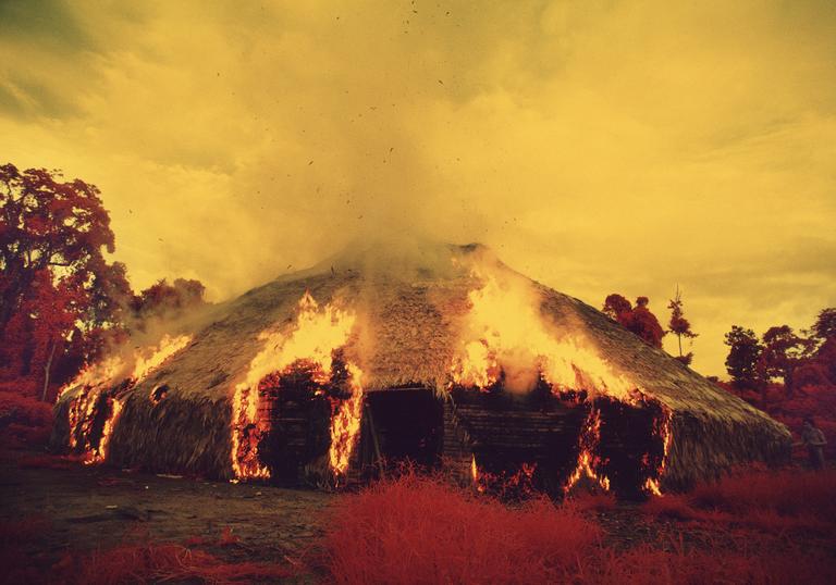 Yanomami dwelling on fire