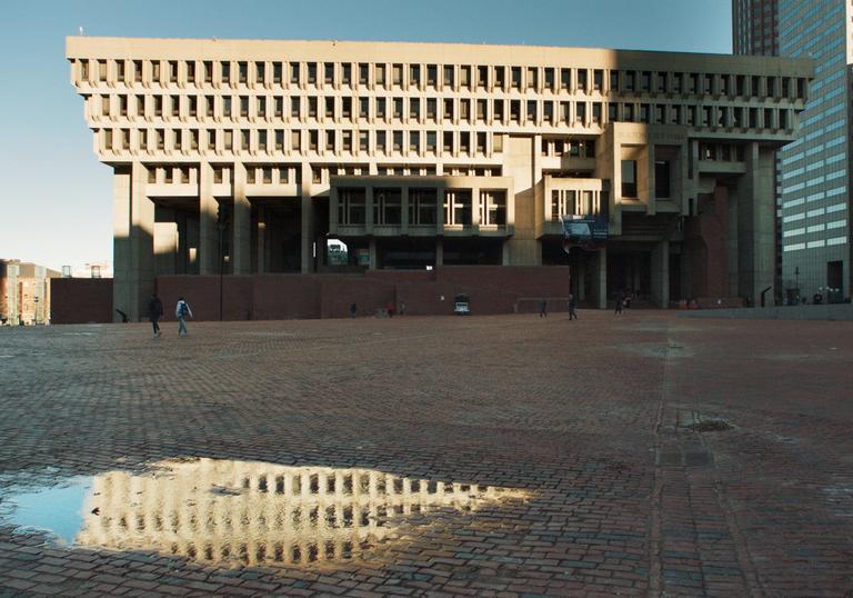 City Hall with a puddle in front of it
