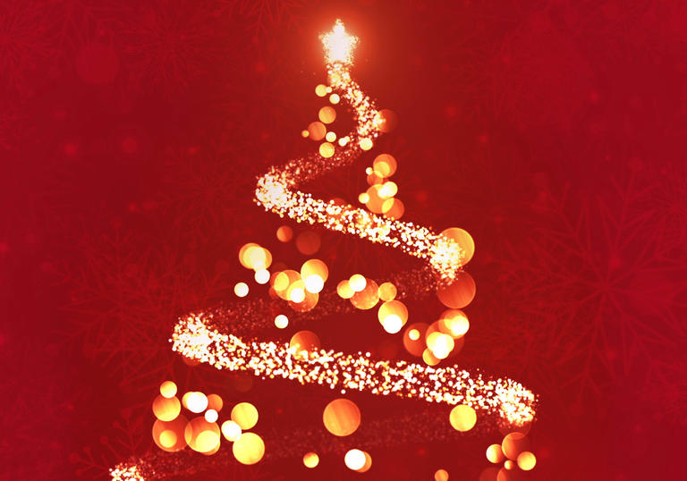 A gold Christmas tree on a red background, made out of light spots and sparkles